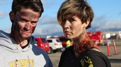 Two COC EMT students with moulage at drill.
