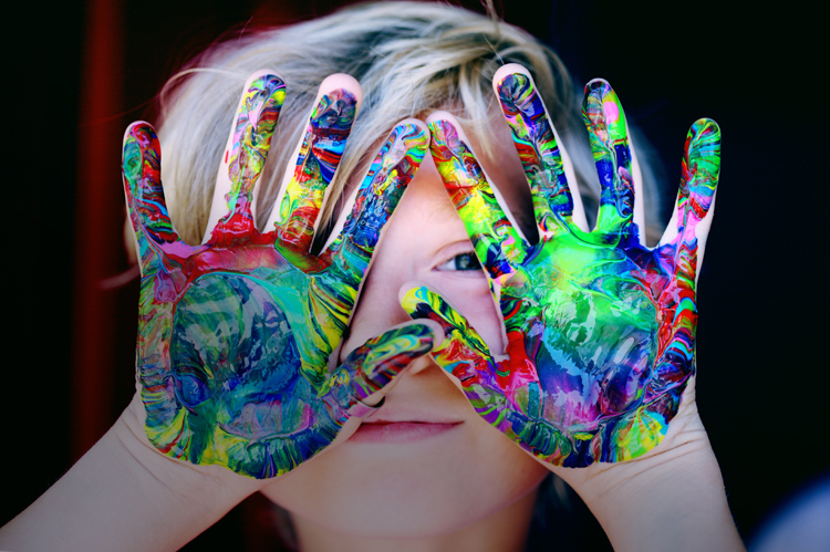 Child with beautiful painted hands.
