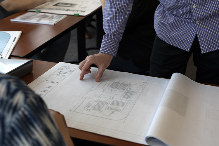 BSBP student receiving instruction and evaluation on building sketches.