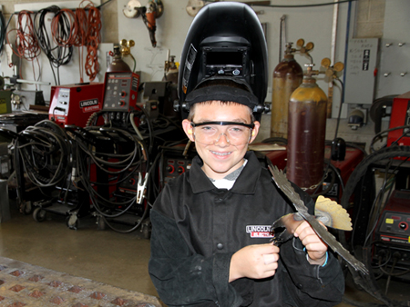 Boy Scouts participating in projects at COC's Welding Department. 
