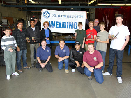 Boy Scouts participating in projects at COC's Welding Department. 