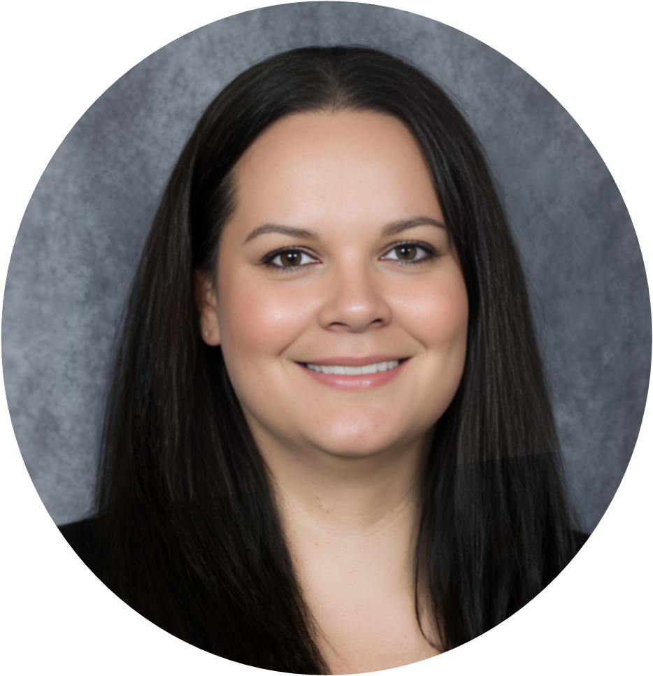 Professional portrait of a woman with long dark hair, smiling against a gray background.