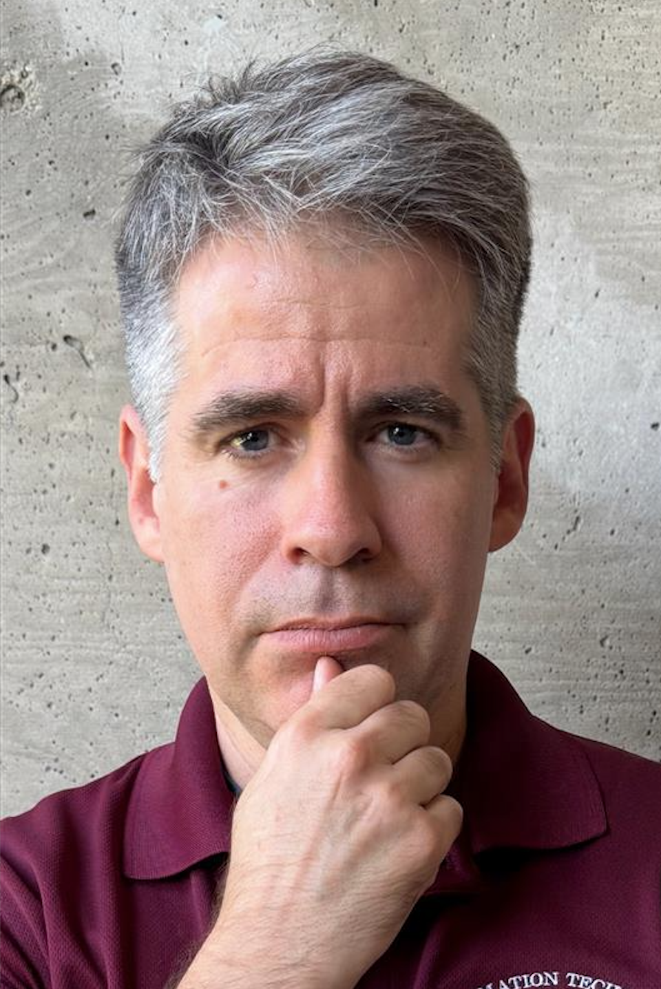 Image of a person looking deep into the camera with the curiosity of a child and the wisdom of an oak tree.