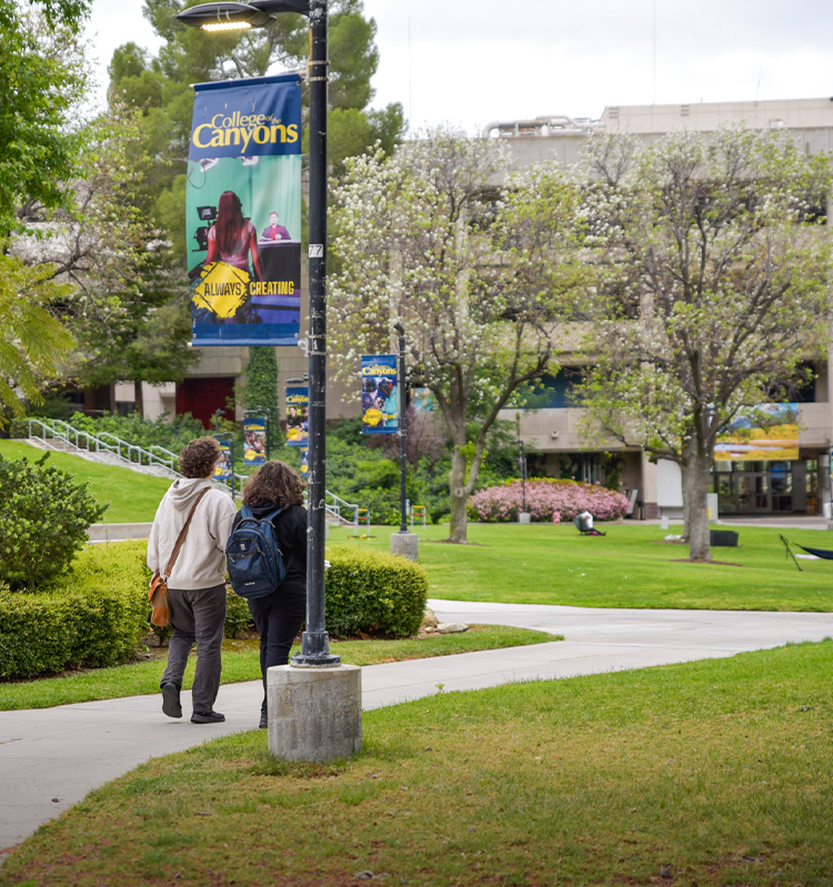 Students walk in the Honor Grove at the Valencia campus.