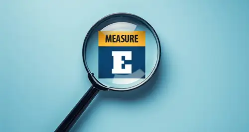 Illustration of magnifying glass bringing "Measure E" into focus.