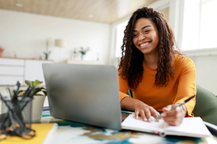 Image of student typing on laptop