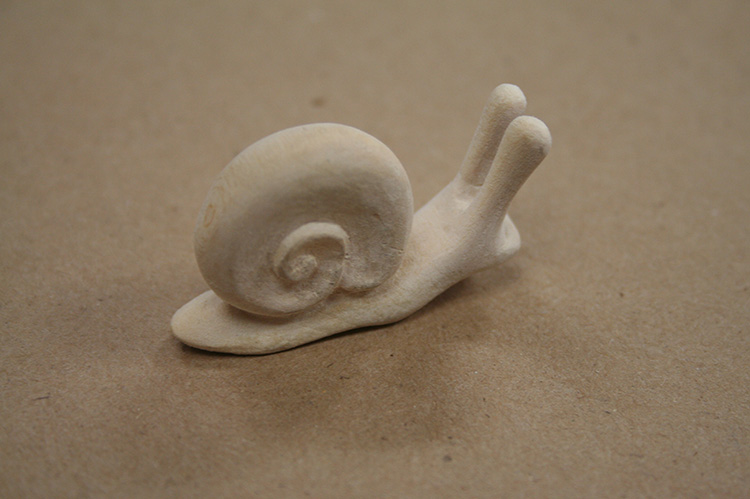 snail carved from wood