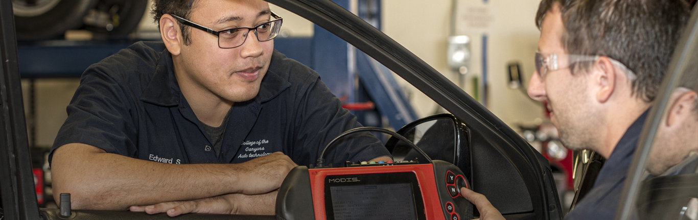 Two Automotive students using MODIS Snap-on engine tester. 