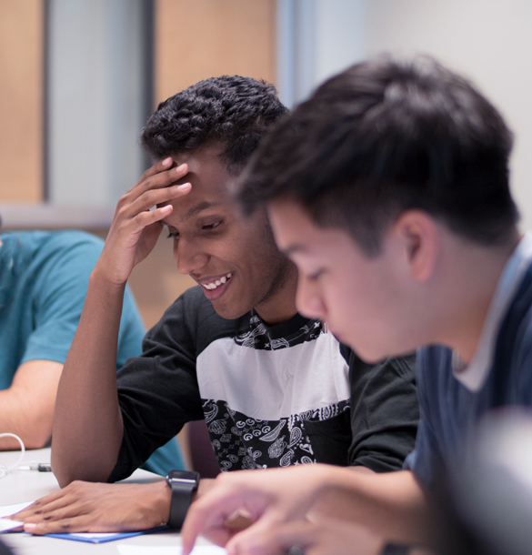 Buisness students in class working on projects. 