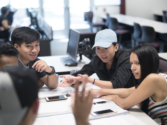 Buisness students in class working on projects.  