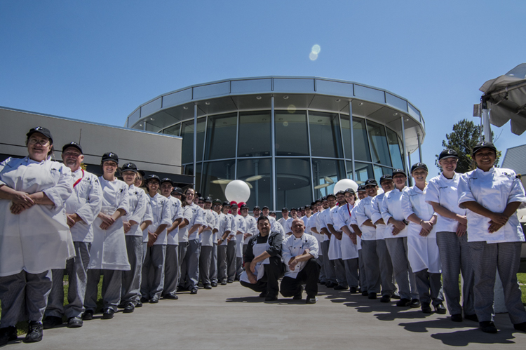 Two rows of iCUE culinary students, with faculty. photo © Robin Spurs