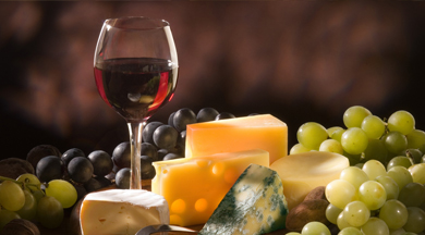 Display of wine, cheese, and grapes. photo © Robin Spurs