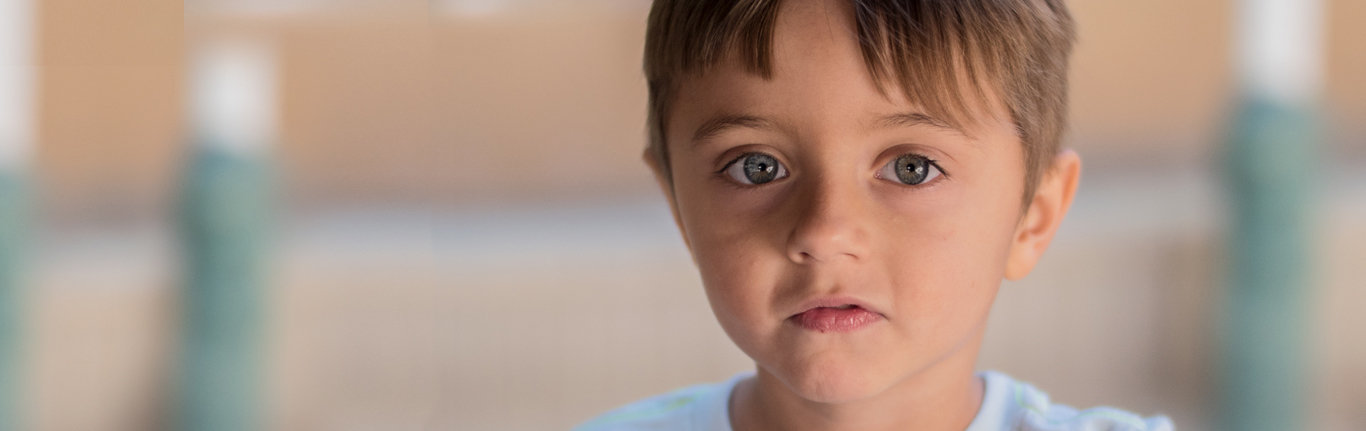 Young boy playing at the Early Childhood Education program. 