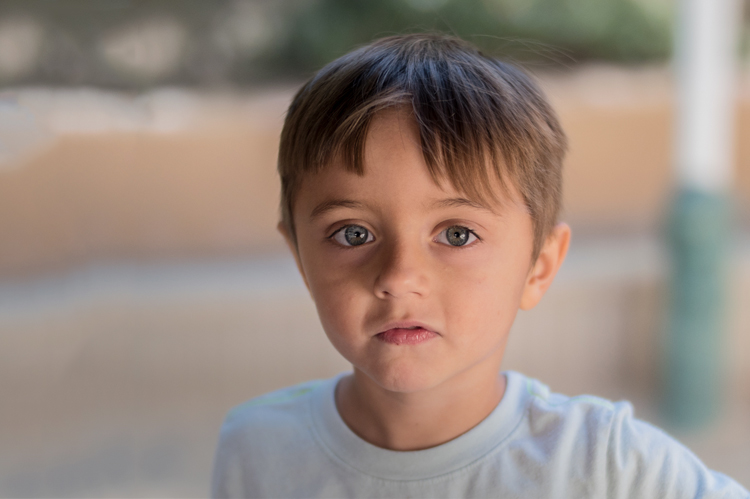 Young boy playing at the Early Childhood Education program. 