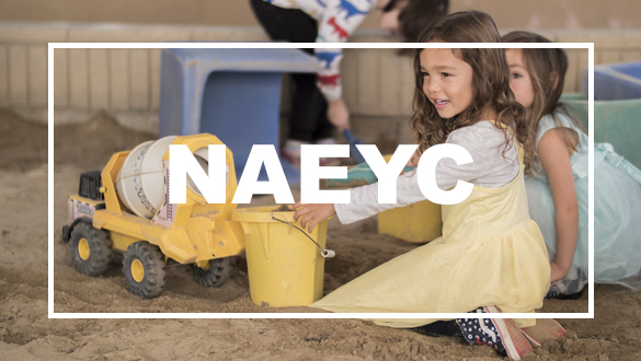 Children playing in sand in the Early Childhood Education program. 