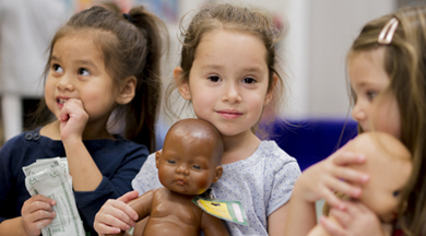 3 little girls with dolls. 