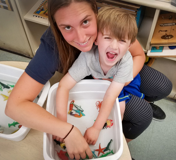 Child with teacher learning through playtime at Center for Early Childhood Education. 