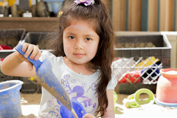 College of the Canyons Canyon Country Center Campus. Child playing with sand.  