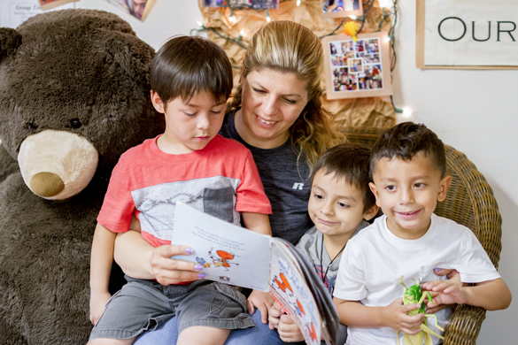 Teacher reading to children at Center for Early Childhood Education. 
