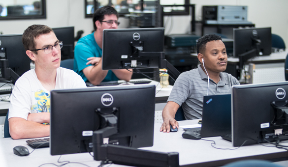 Electronic Systems Technology students at computers.  