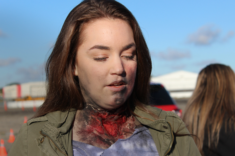 COC EMT student with neck wound moulage.