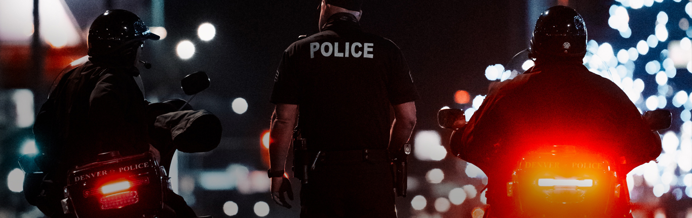 Motorcycle police at night.