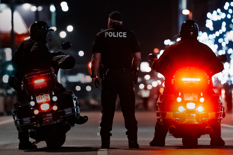 Motorcycle police at night.