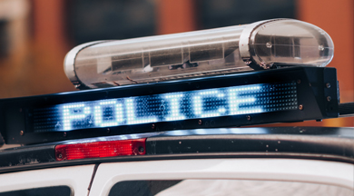 Police Car lights on top of car.