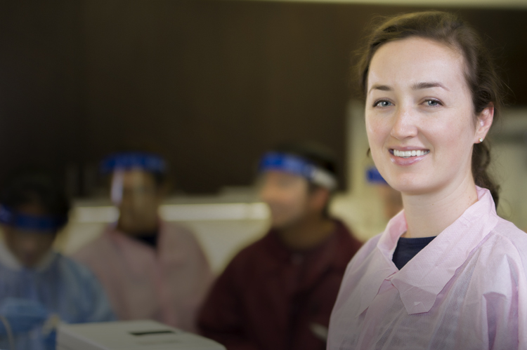 MLT students in lab coats and splash masks. photo © Robin Spurs