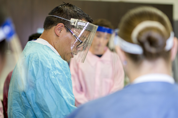 Medical Laboratory Technician instructor with students in lab.  