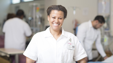 Nursing student in lab site hospital room.