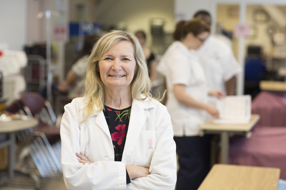 Nursing instructor in the lab with students.