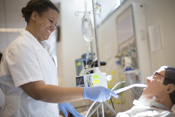 Nursing student working in lab.