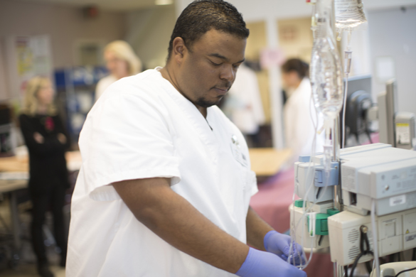 Nursing student in lab.