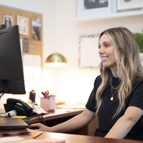 Staff coordinator on computer