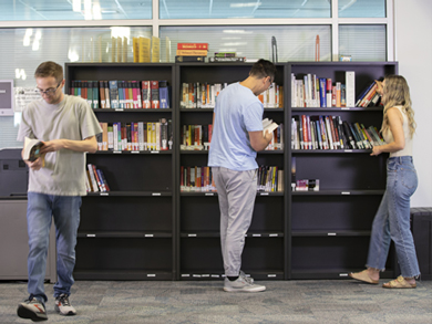 Students at bookshelves