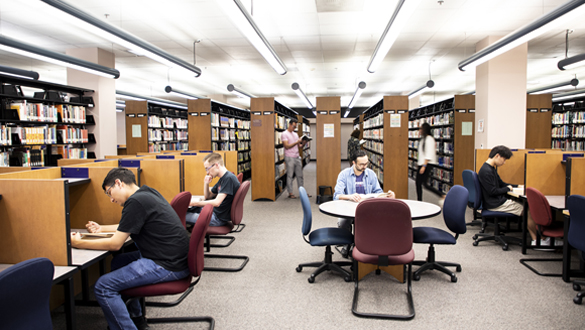 Instructors and students in the COC Library.