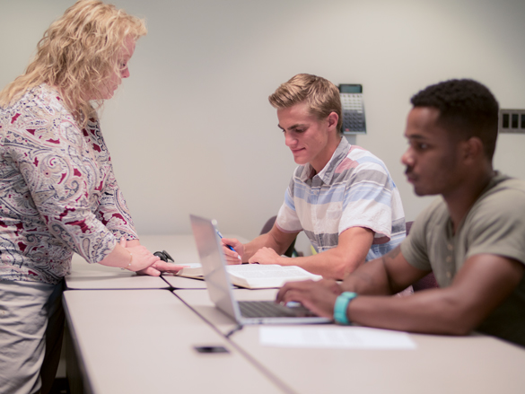 Paralegal instructor working with students.