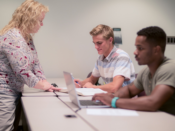 Paralegal instructor working with students. 