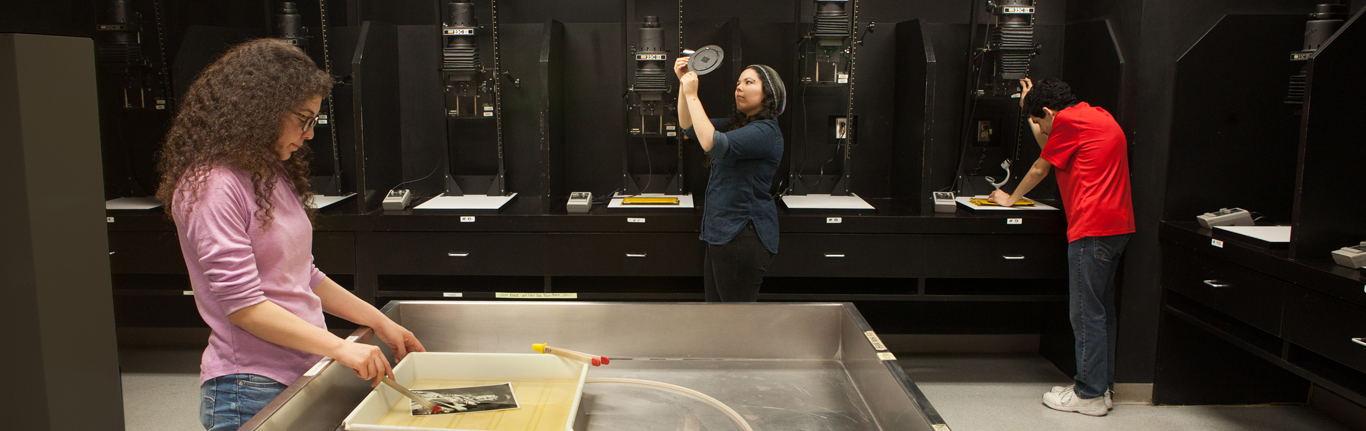 COC Photography students in darkroom.