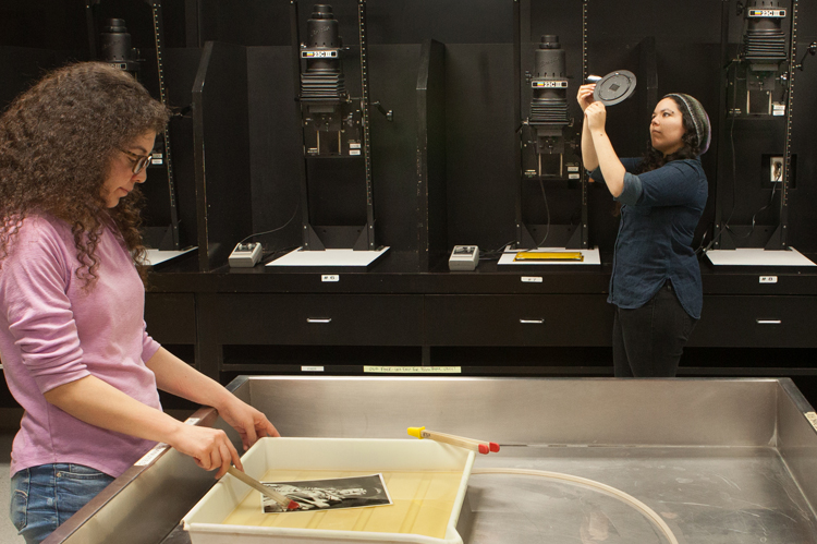 COC Photography students in darkroom.