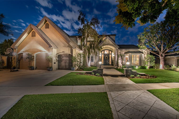 Beautifully lit home at twilight.