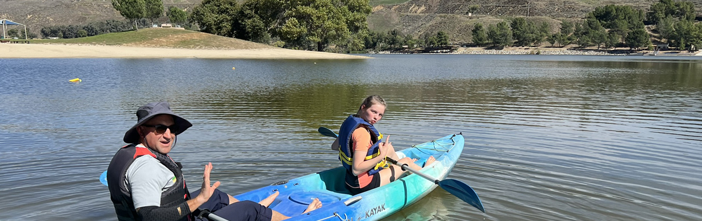 Students kayaking on a lake.