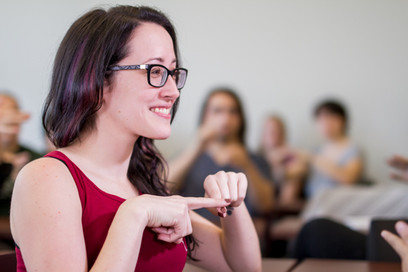 Student using sign language. 