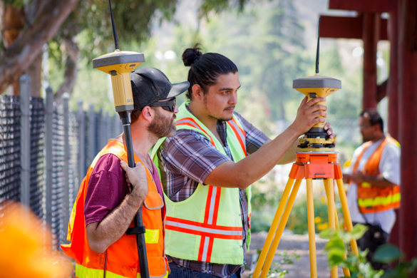 Members of CRC’s team work on the Community Gardens’ land surveying project. 