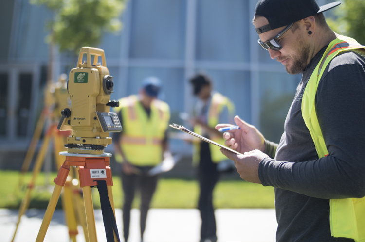 Land Surveying students learning surveying equipment. 