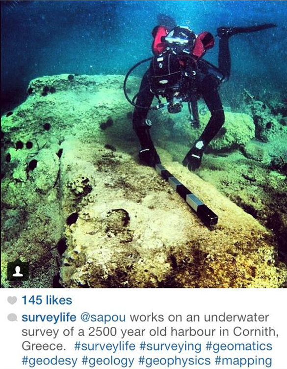Land Surveyor in scuba gear surveying the ocean floor.