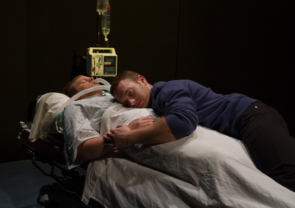 Two actors in hospital dying scene.