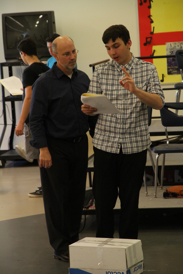 Actors practicing script.