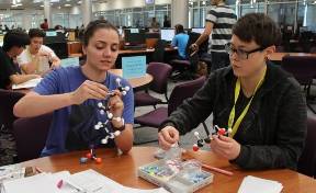 Student working with chem tutor in TLC